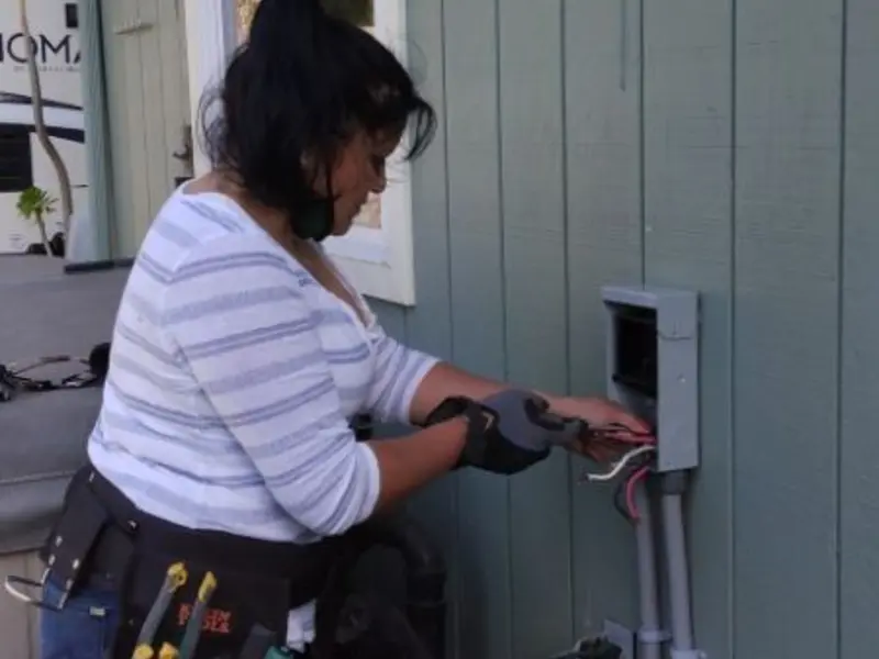 Licensed electrician wiring an exterior subpanel in Edgmont
